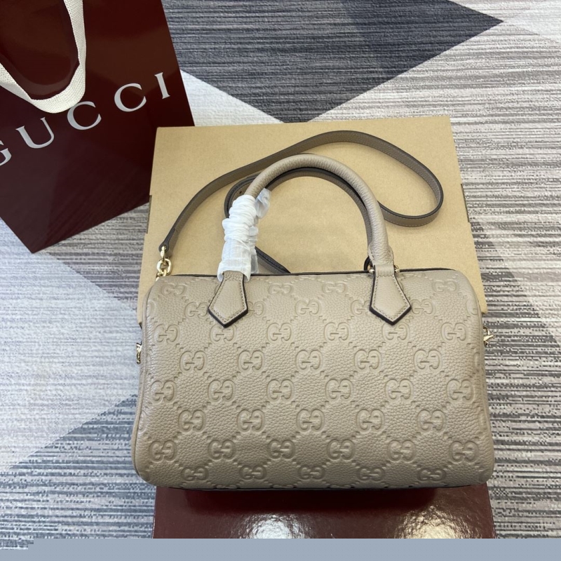 G*u*i top handle bags